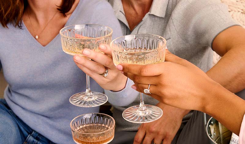 Woman wearing pave lab grown diamond engagement ring on hand