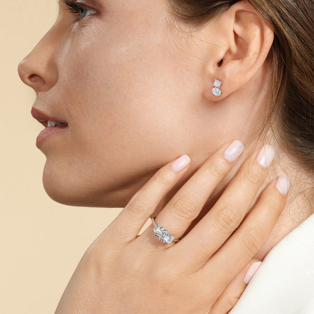 Model Wearing Toi et Moi Square Emerald and Oval Diamond Stud Earrings view