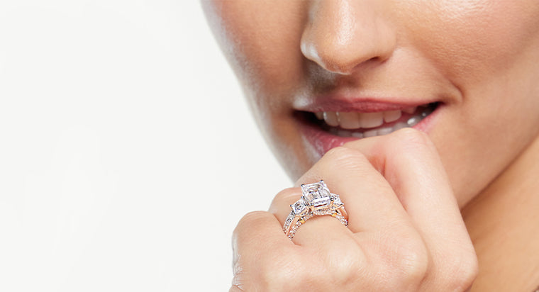 Model showing her lab diamond side stone engagement ring