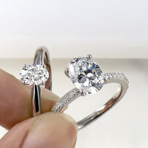Four prong oval moissanite solitaire white gold ring & oval pave moissanite white gold ring