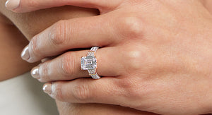 A model displaying her Solitaire Engagement Ring
