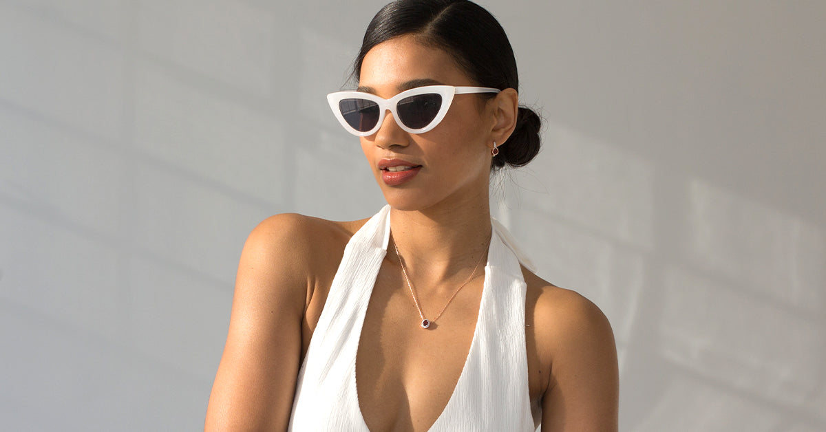 Model displaying her custom made gemstone metal earrings.