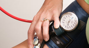 woman filling out form wearing good engagement ring for doctors