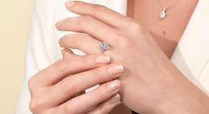woman's hands wearing bezel setting