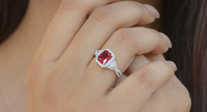 Gold ring with red stone deals meaning