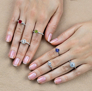 Gemstone rings on hand: Ruby, Moissanite, Peridot, Blue Sapphire, Diamond