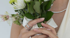 A model showing her wedding bands