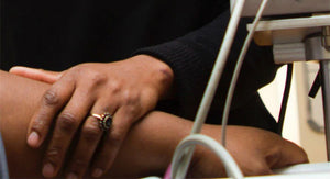 nurse helping patient and wearing engagement ring