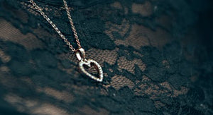 heart shaped jewelry: yellow gold necklace, rose gold necklace, white gold ring, white gold ring