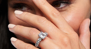 Model displaying her emerald cut lab grown diamond engagement ring