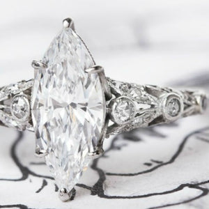 edwardian style engagement ring with marquise center stone