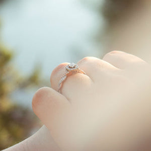 profile of engagement ring on woman's hand