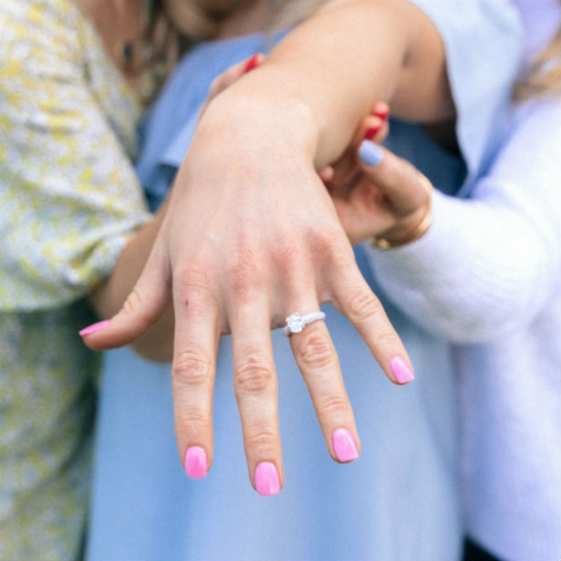 woman showing off her pretty engagement ring