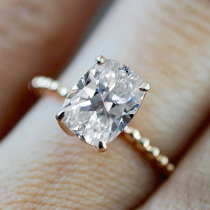womans hand wearing ring with crushed ice diamond