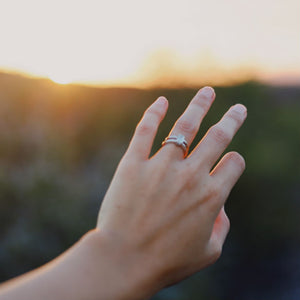woman's hand wearing double band engagement ring