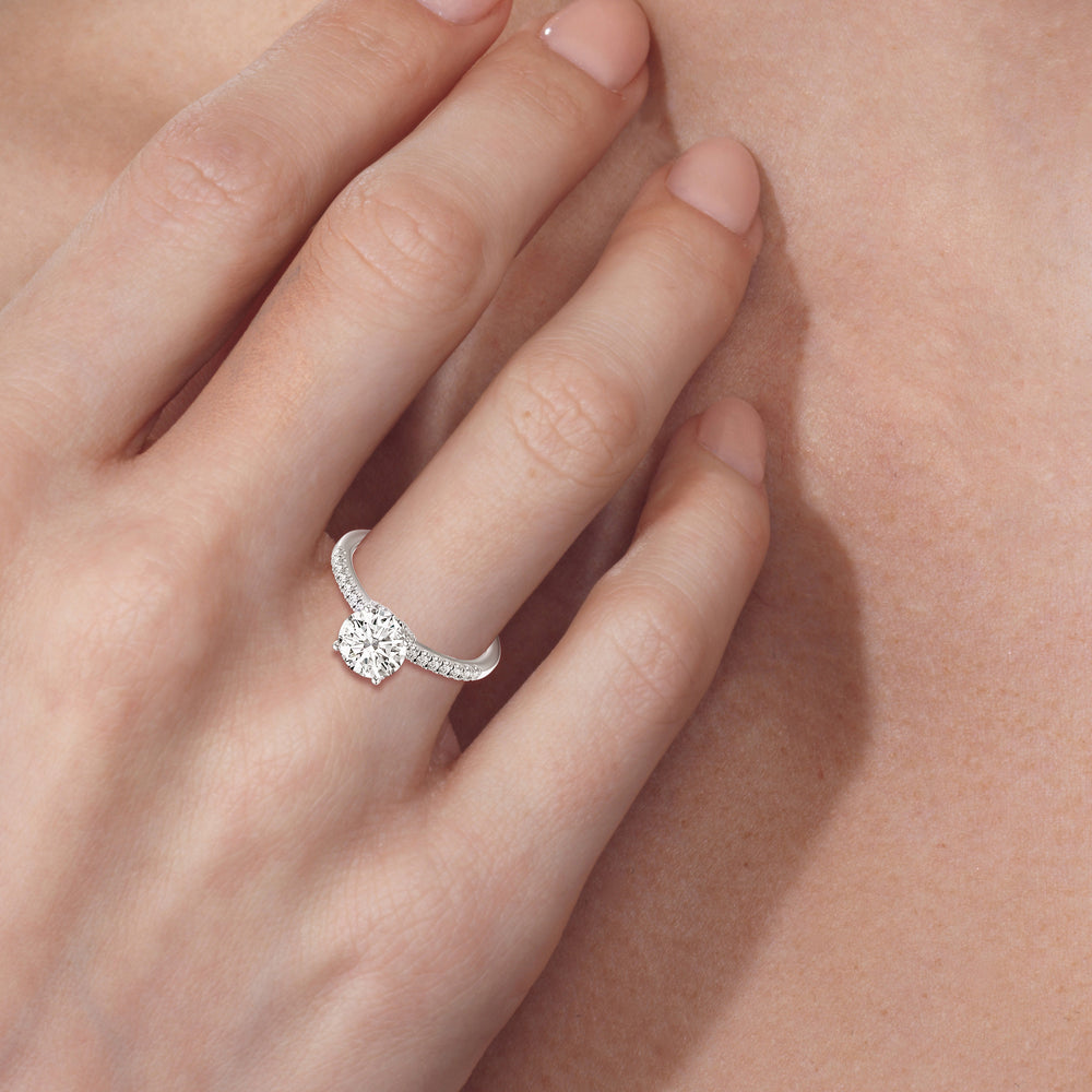 Model Wearing 2 1/4 cttw Oval Cut Arc Hidden Halo Engagement Ring view