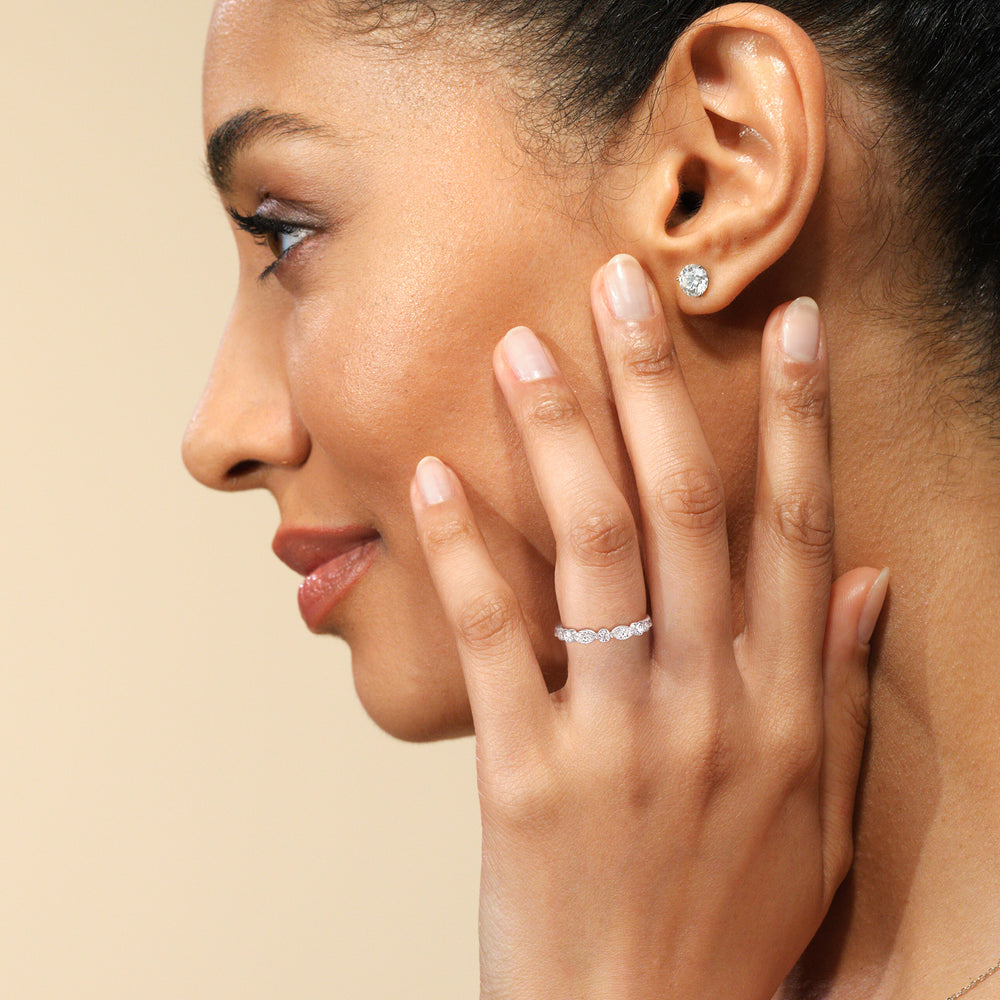 Model Wearing Glamorous Fancy Side Stones Catherdral Diamond Wedding Band view
