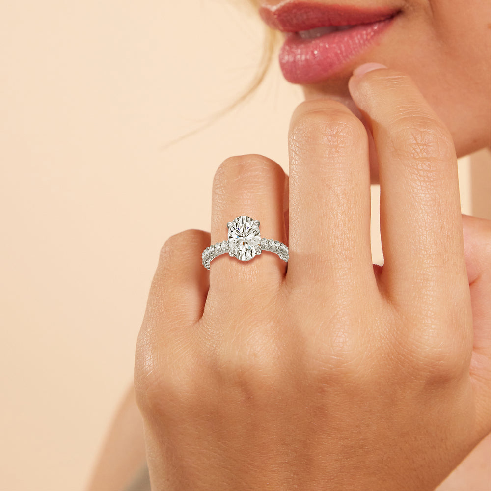 Model Wearing Hidden Halo Oval Side Stones Engagement Ring view