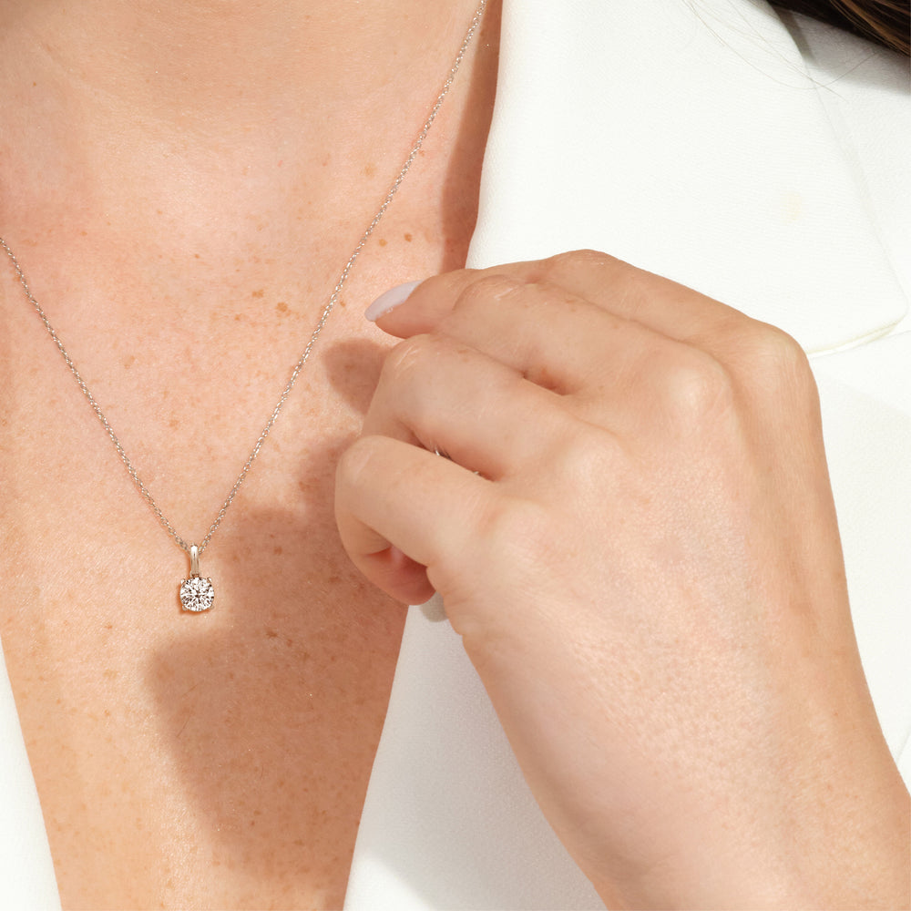Model Wearing Knife-Edge Bale Round Lab Created Diamond Solitaire Pendant view