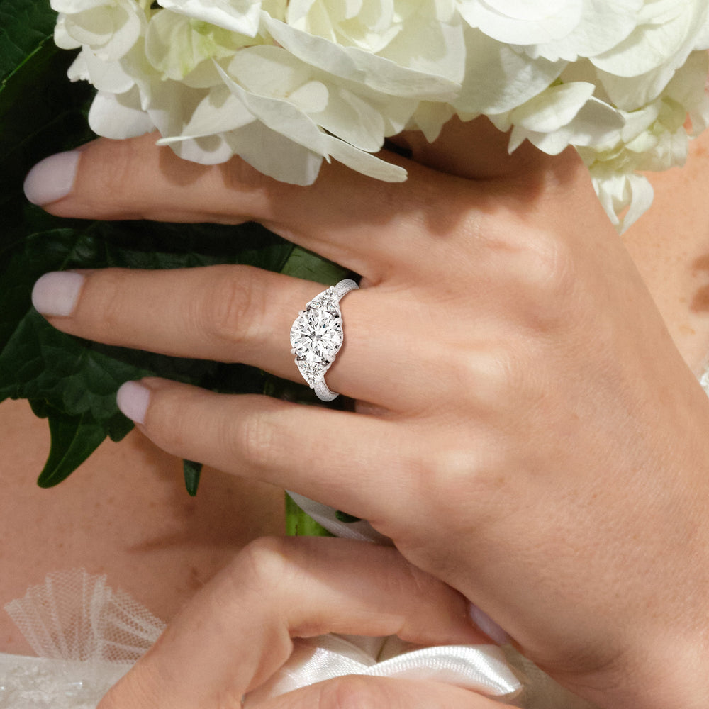 Model Wearing 4.50ct Oval Windsor Trillion Three Stone Lab Diamond Engagement Ring view