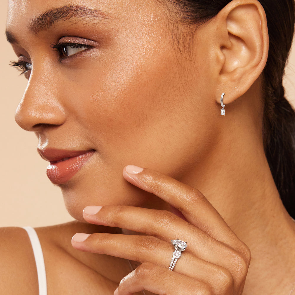Model Wearing Emerald Diamond Drop Knife Edge Huggies view