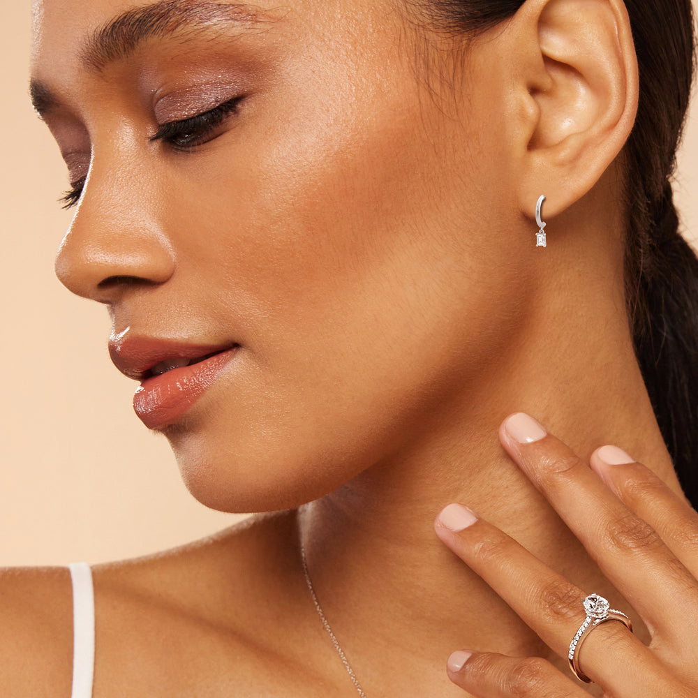 Model Wearing Emerald Diamond Drop Knife Edge Huggies view