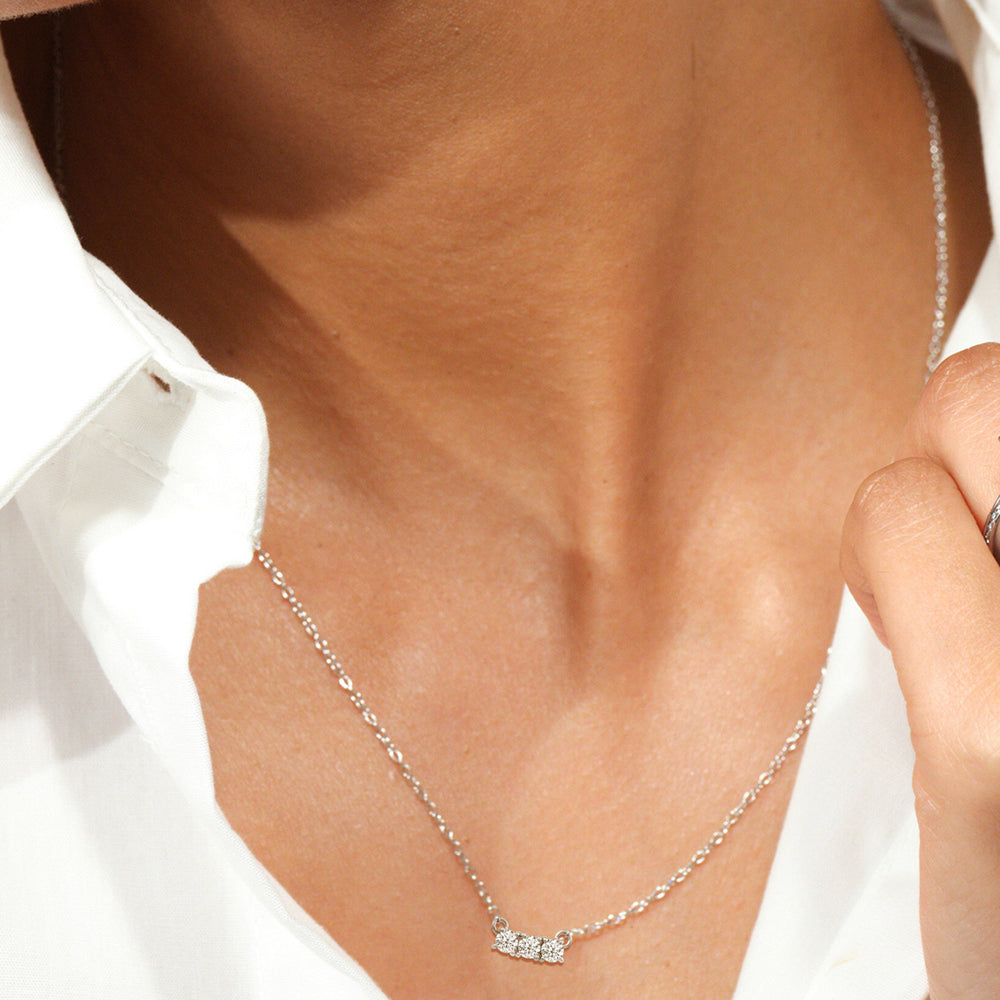 Model Wearing Dainty Three Stone Diamond Necklace view