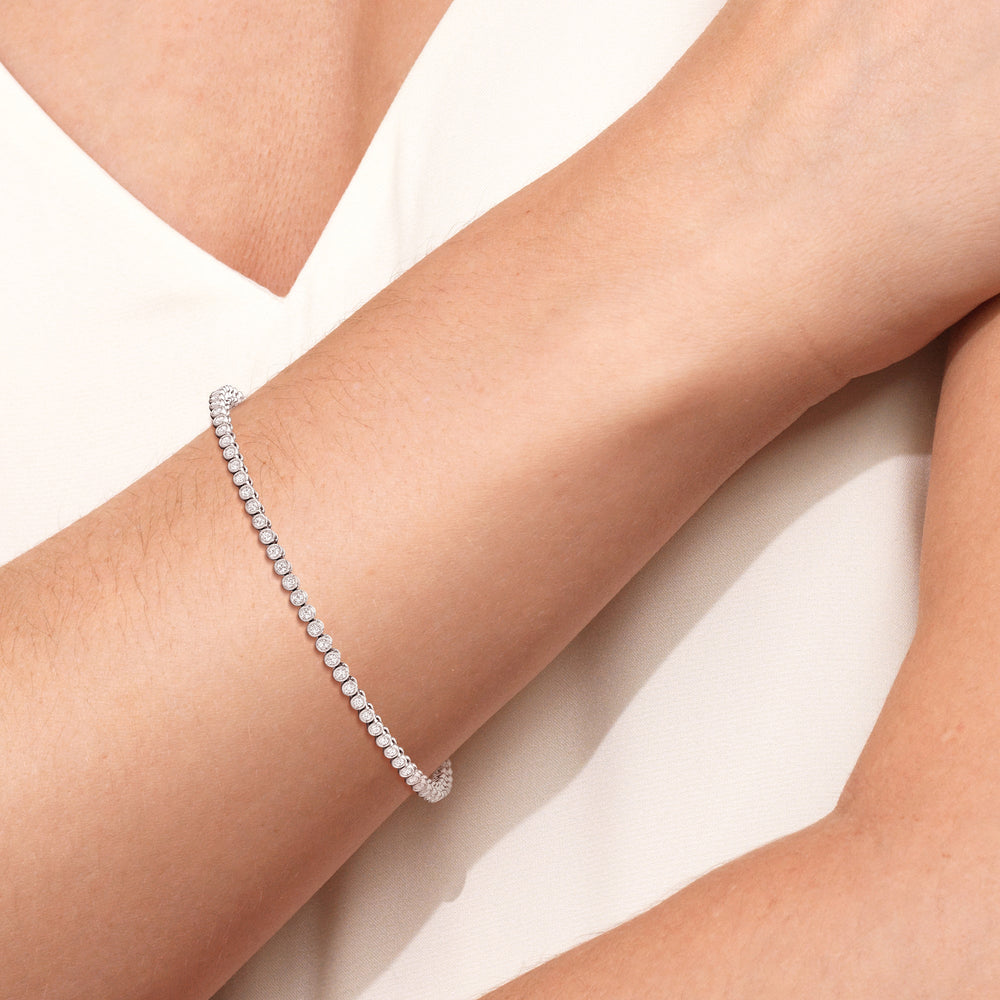Bezel Set Round Lab Diamond Tennis Bracelet with 1 Cut Diamond in 14KT White Gold view 4
