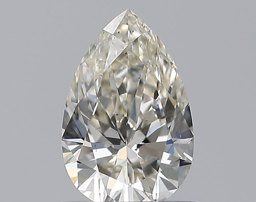 0.61 Carat Pear Natural Diamond with  Cut Diamond in 14KT  view 1
