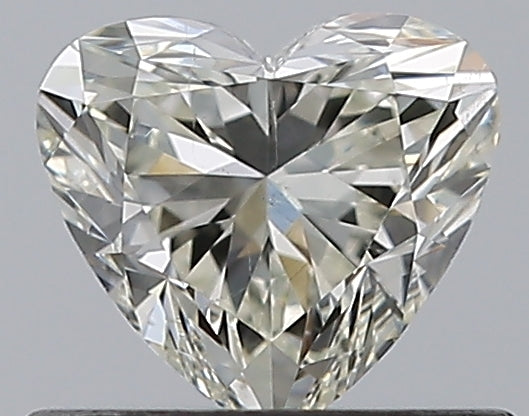 0.57 Carat Heart Natural Diamond with  Cut Diamond in 14KT  view 1
