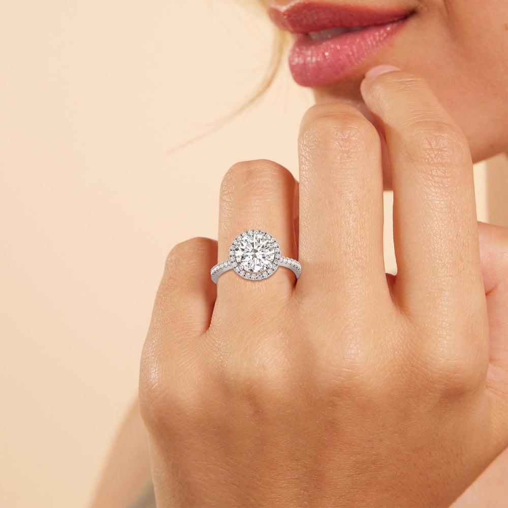 Model Wearing Halo And Scalloped Hidden Halo Cathedral Engagement Ring view