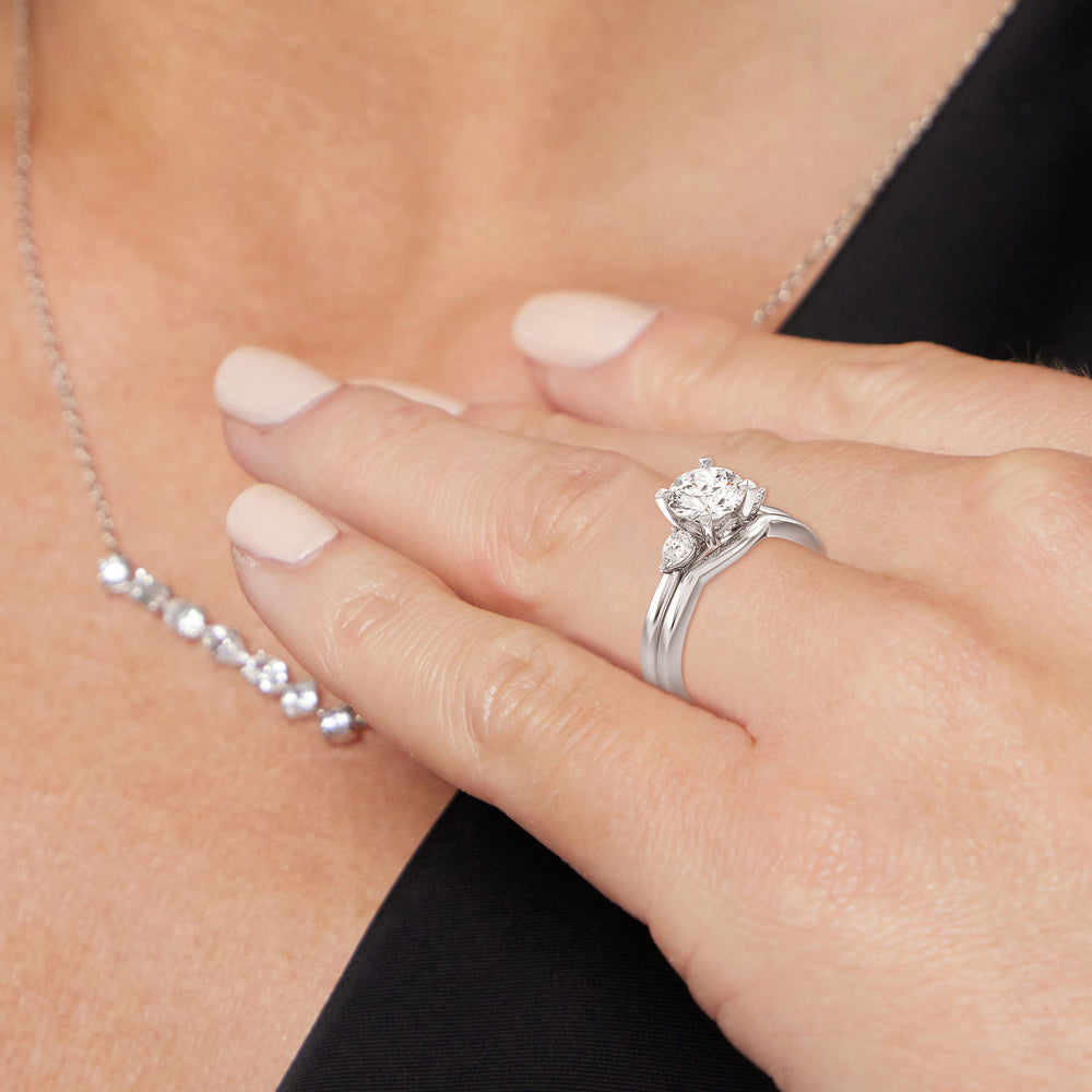 Model Wearing Fine Line Pear Three Stone Wedding Band view