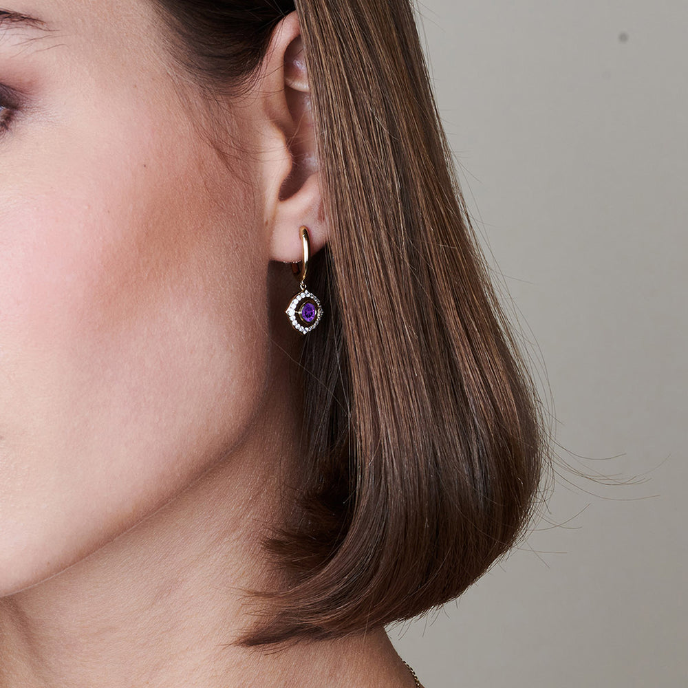 Model Wearing Signature Amethyst Birthstone Drop Huggies view