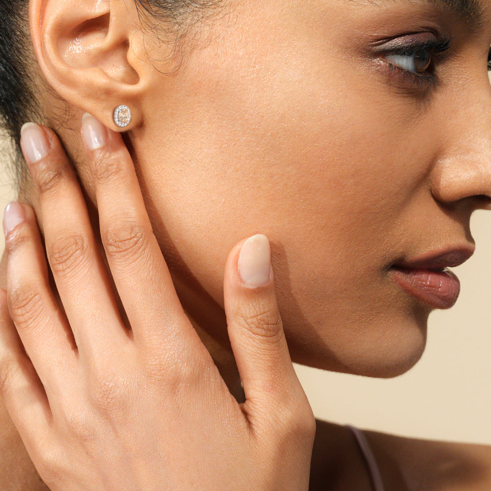 Model Wearing Oval Morganite and Lab Diamond Classic Solitaire Halo Earrings (14KT White Gold) view