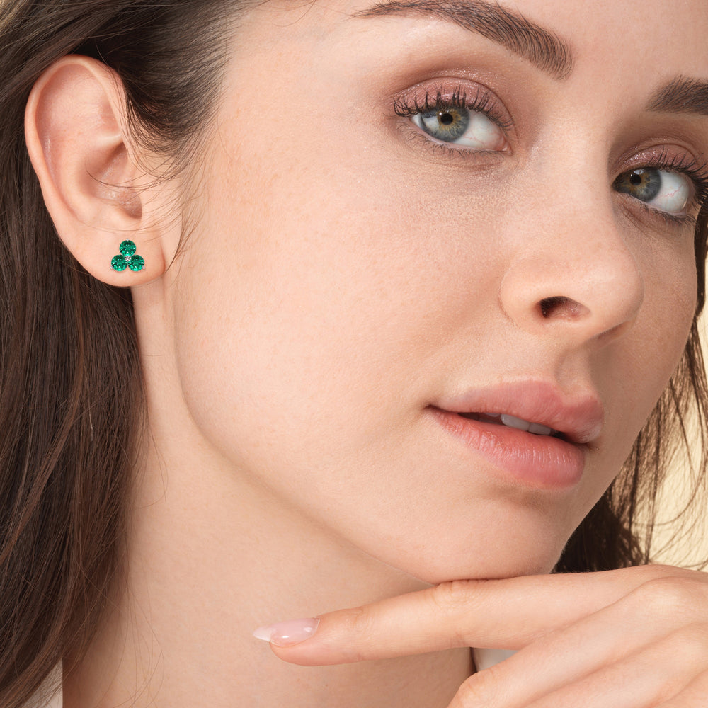 Model Wearing Emerald Classic Three Stone Cluster Earrings view