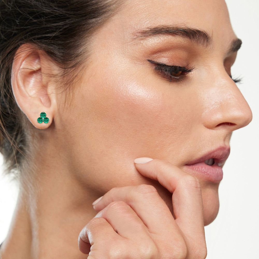 Model Wearing Emerald Classic Three Stone Cluster Earrings view