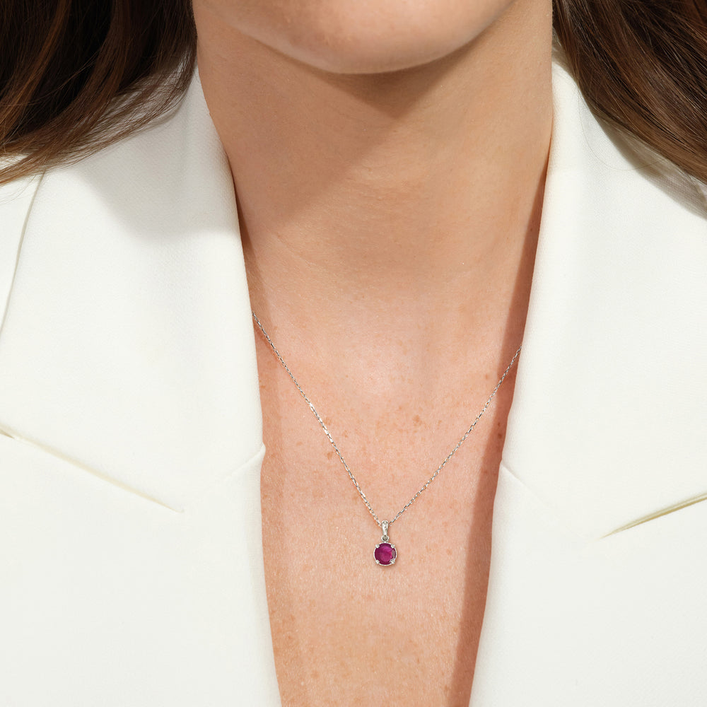 Model Wearing Round Ruby and Lab Diamond Classic Solitaire Under Halo Pendant view