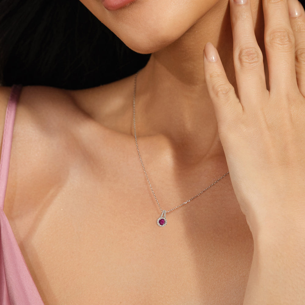 Model Wearing Round Ruby and Lab Diamond Classic Halo Pendant With Studded Split Bale view
