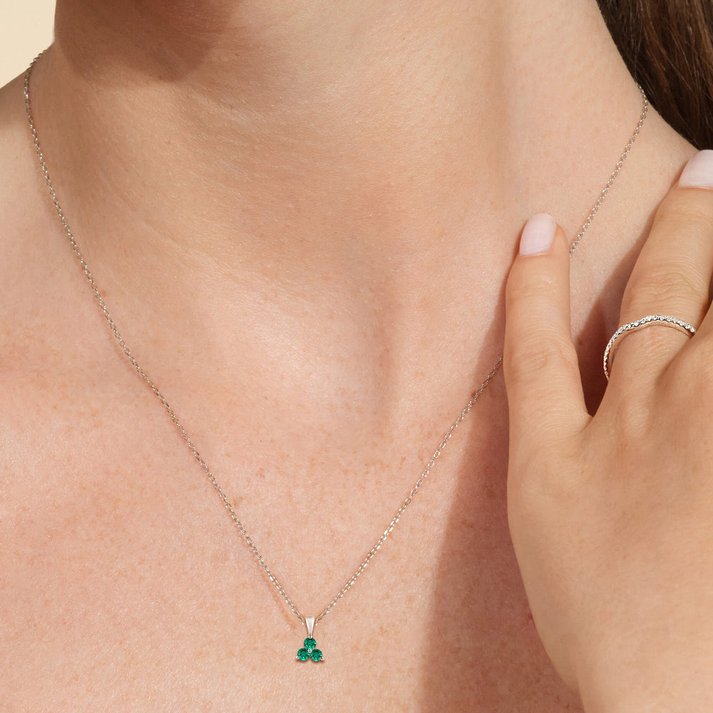 Model Wearing Emerald Three Stone Cluster Pendant view