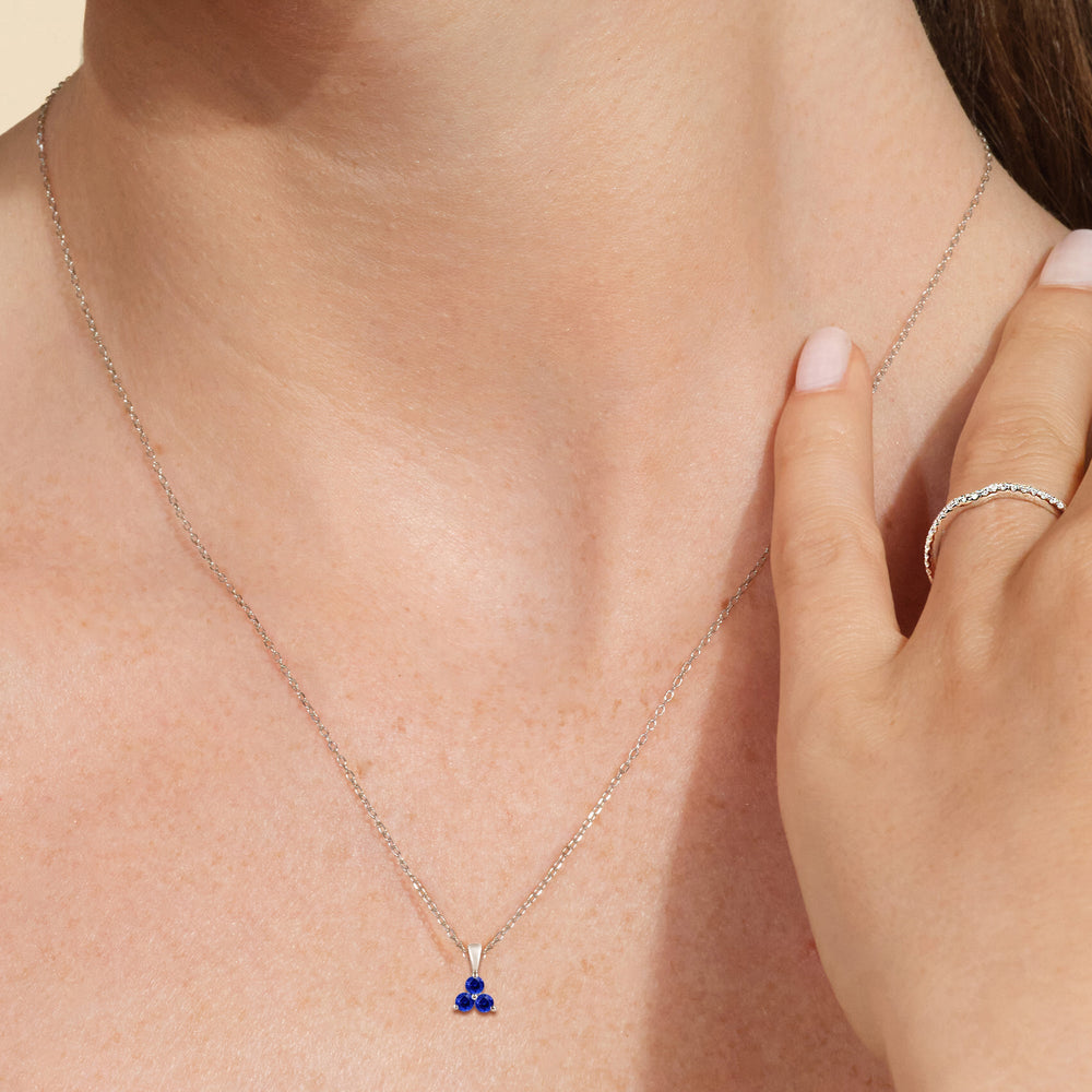 Model Wearing Sapphire Three Stone Cluster Pendant view