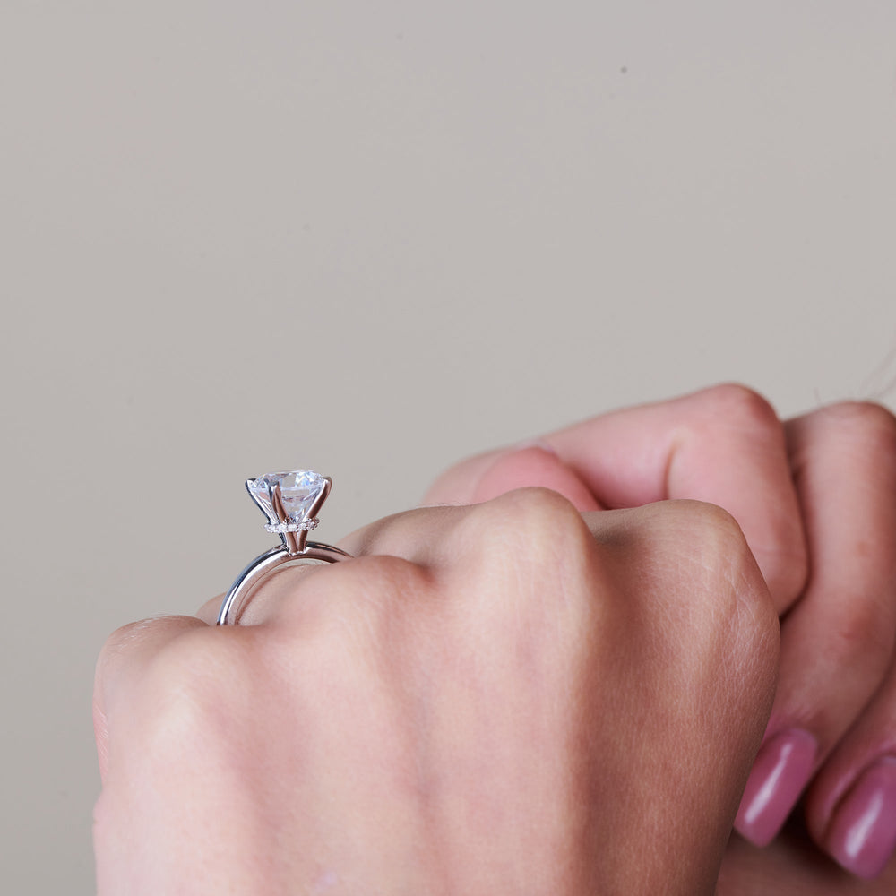 Model Wearing Petite Modern Fine Line Hidden Halo Engagement Ring view