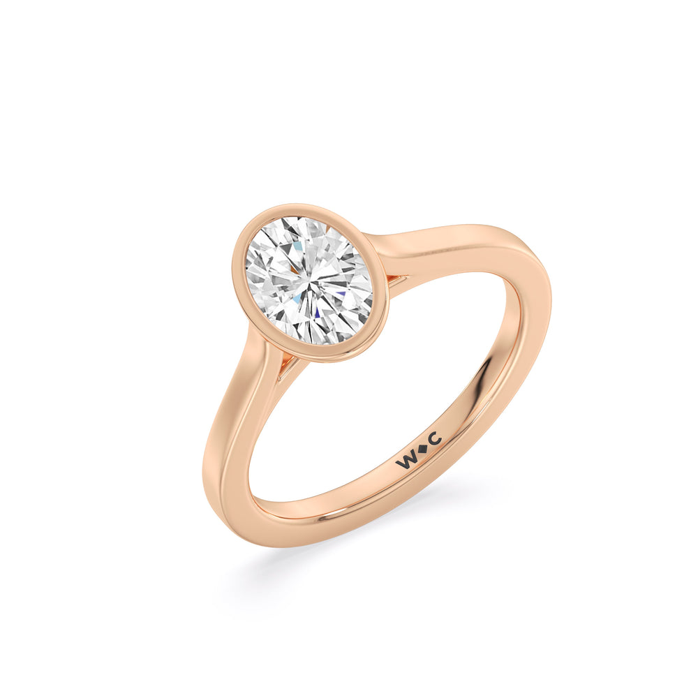 Fine Bezel Solitaire Engagement Ring with Oval Cut Diamond in 14KT Rose Gold view 3
