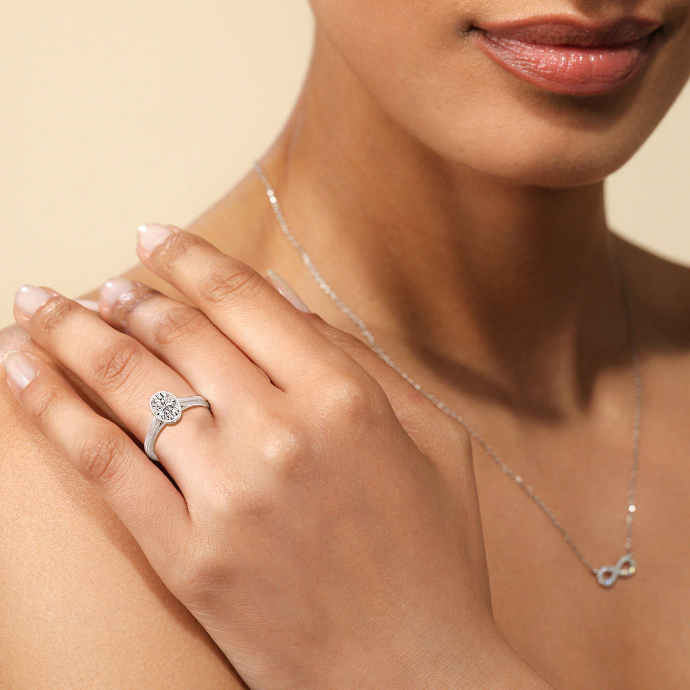 Model Wearing 2.09ct Emerald Fine Bezel Solitaire Engagement Ring view