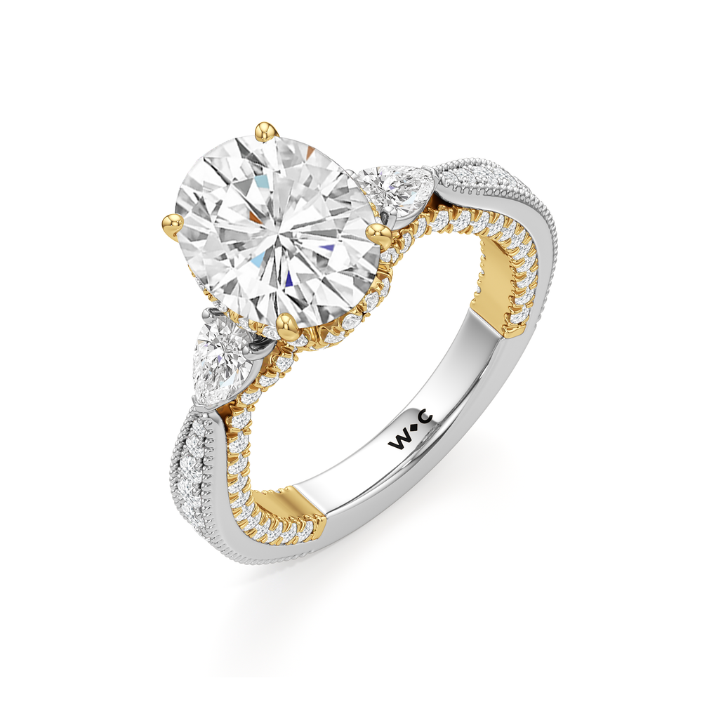 The Chrysler Pear Three Stone Ring with Oval Cut Diamond in 14KT White & Yellow Gold view 3
