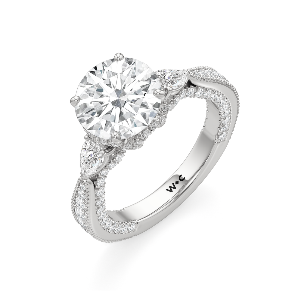 The Chrysler Pear Three Stone Ring with Round Cut Diamond in 14KT Platinum view 3
