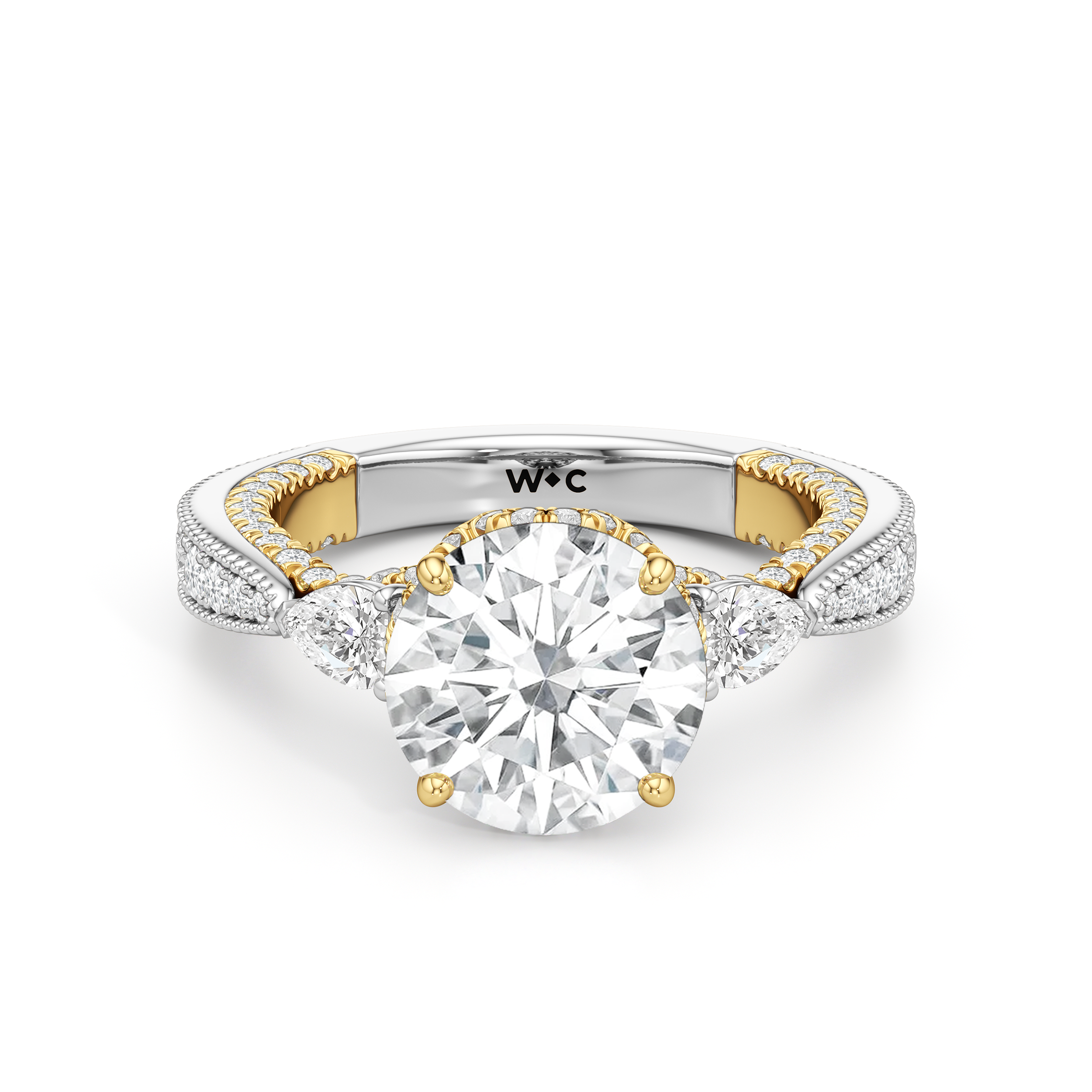 The Chrysler Pear Three Stone Ring