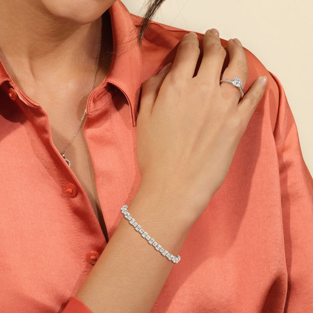 Model Wearing Alternating Bezeled Emerald Tennis Bracelet view