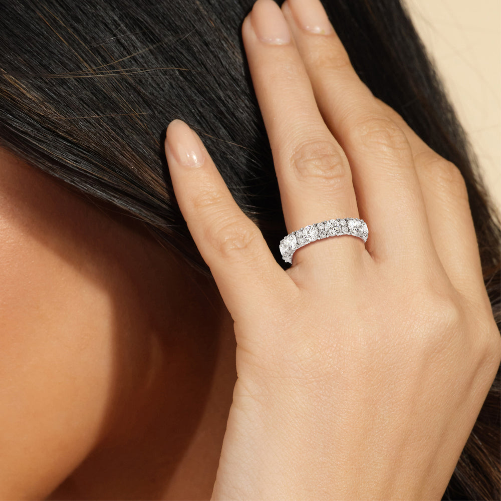 Model Wearing Round Station Eternity Ring (F/G SI+) view