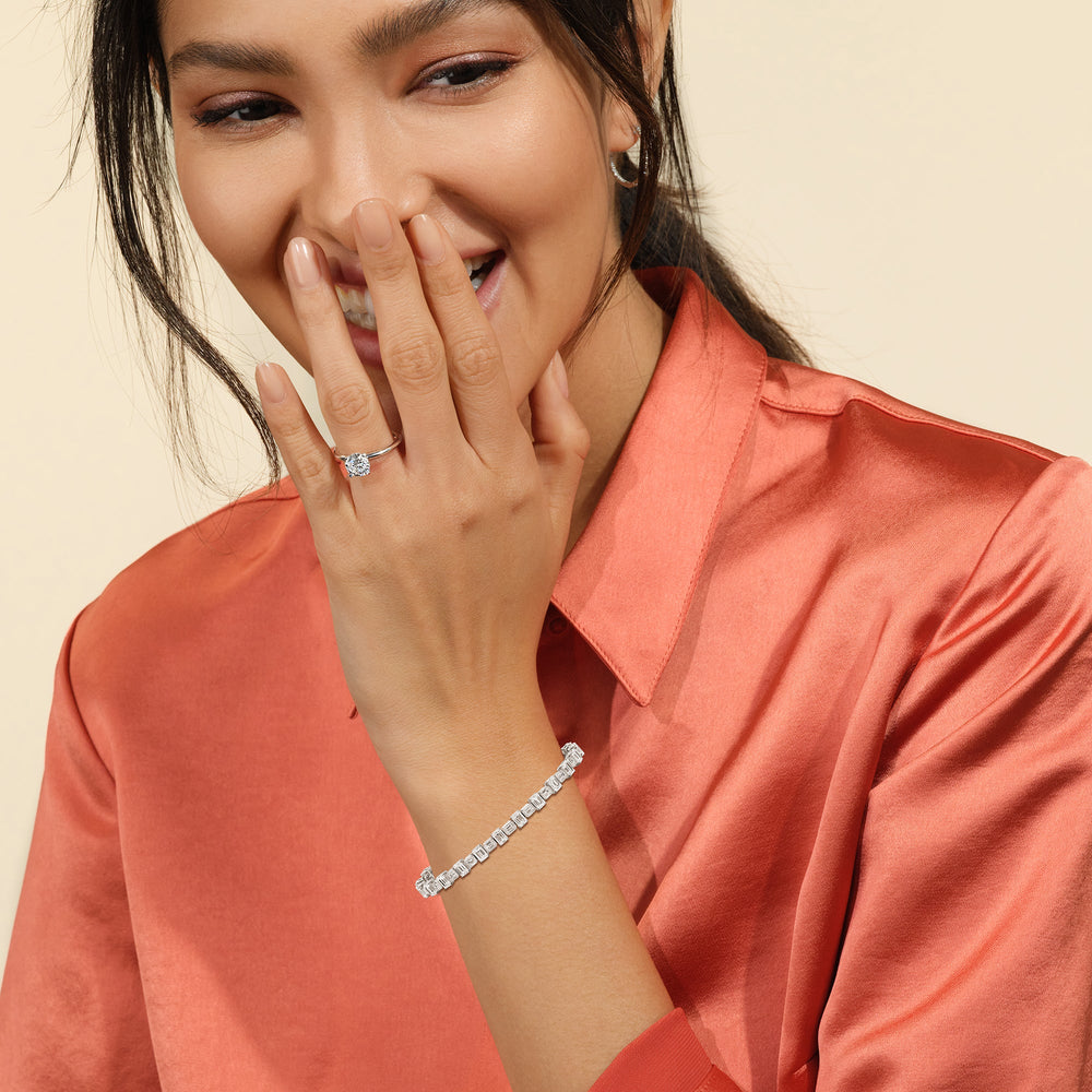 Model Wearing Alternating Bezeled Emerald Tennis Bracelet view