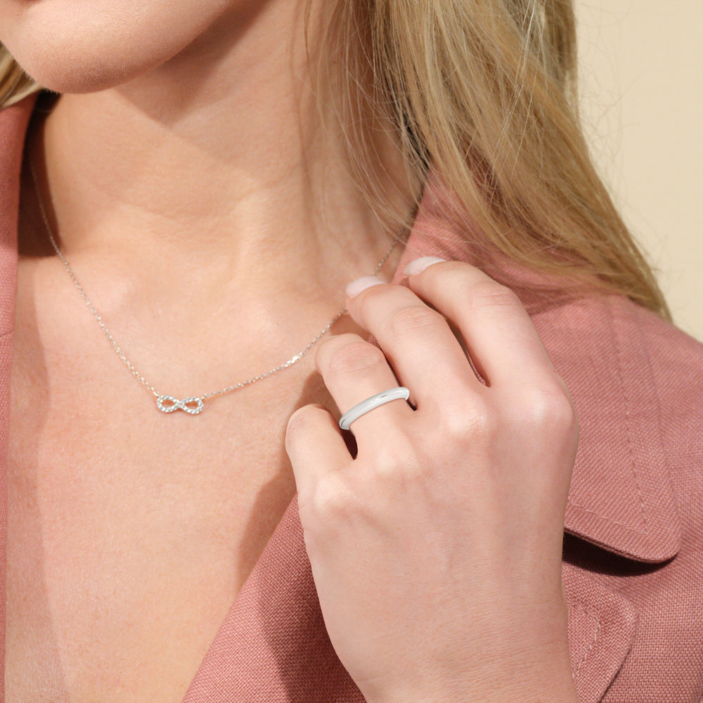 Model Wearing Tapered Cathedral Solitaire Wedding Band view